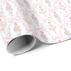 a pink and white wrapping paper with ballerinas on it