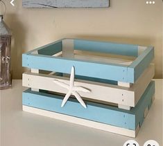 three wooden crates with starfish on them