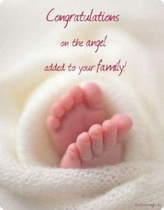 a baby's feet in the middle of a blanket with congratulations written on it