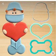 cookie cutters and stencils with a baby holding a heart in the shape of a dog