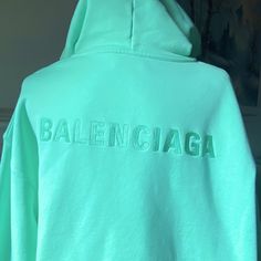 Balenciaga Embroidered Logo Cotton Hoodie That Is Brand New. In Excellent Condition! Sweatshirt Is Mint Green And Unisex. It Is A Very Big Hoodie, Could Be Worn By Men Or Women. Size Medium, But It Is Comfortably Oversized. Also, Has A Kangaroo Pocket. Trendy Winter Tops With Logo Detail, Green Sporty Hoodie With Embroidered Logo, Sporty Green Hoodie With Embroidered Logo, Green Logo Print Sweatshirt For Spring, Mint Green Hoodie, Mint Hoodie, Hoodie Street Style, Big Hoodie, Balenciaga Hoodie