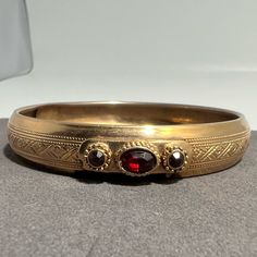 Condition: Pre-Owned / Good Condition Jewelry Material: Gold Filled Style: Victorian Revival Interior Circumference: 8” Thickness: 12.5mm (.5”) Weight: 21.6 Grams Dark Rise, Victorian Bracelet, 1800s Fashion, Victorian Revival, Bangle Bracelet, Red Gold, Womens Jewelry Bracelets, Fashion Bracelets, Lady In Red