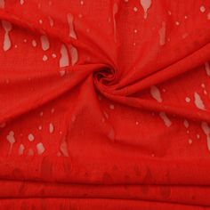 red fabric with white spots on it