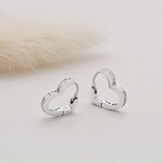 Show your jewellery collection some love and add in these beautiful heart huggie hoop earrings. Whether there is a special someone in your life whom you wish to treat or need a little pick me up, these earrings are perfect. Set with cubic zirconia stones to give them an added sparkle. They are complete with a secure click-in fastening for wearing day and night. Sure to be loved by all ages.  Internal Height: 9mm 925 Sterling Silver, Cubic Zirconia Stones Le Port, To Be Loved, Huggie Hoop Earrings, Beautiful Heart, Jewelry Earrings Hoops, Jewellery Collection, Sterling Silber, Etsy Earrings, Cubic Zirconia