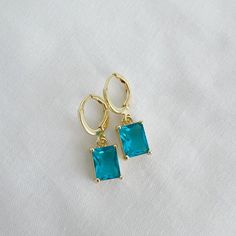 Gorgeous 14k gold filled blue baguette huggie style hoops. Lightweight. Size: 1” 14k gold filled hoops Charms: 10mm x 7mm Lead & nickel free Hypoallergenic Handmade Includes 100% organic cotton jewelry pouch This item is made to order, packaged, and shipped with love from our studio located in West Chester, PA. *Click here to learn more about gold filled jewelry Cotton Jewelry, West Chester, Hoop Charms, Gold Filled Hoops, Gold Filled Jewelry, Jewelry Pouch, Gold Filled, Pouch, Gold