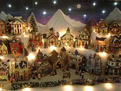 a large display of christmas village lights and decorations