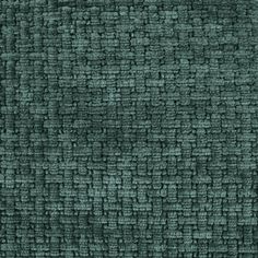 an upholstered green fabric textured with small squares