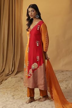 Orange chanderi silk cutwork kurta with floral hand paint and tasselled mirror work embroidery. Paired solid scallop edged dupatta and solid straight pant. - Aza Fashions Designer Chanderi V-neck Salwar Kameez, Designer V-neck Chanderi Salwar Kameez, Navratri Silk Churidar With Chikankari Embroidery, Silk Churidar With Floral Embroidery For Diwali, Diwali Silk Churidar With Floral Embroidery, Silk Unstitched Suit For Navratri, Red Chanderi Churidar With Floral Embroidery, Red Churidar With Floral Embroidery In Chanderi, Floral Embroidered Red Churidar In Chanderi