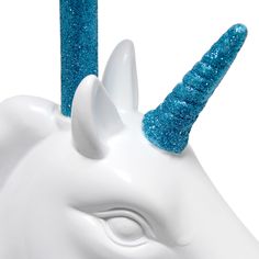 a white unicorn head with blue glitter on it