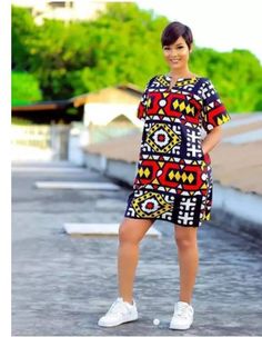 This beautiful mini dress is handmade with African fabric.it is fully lined,has 2sides pocket. Kindly send your measurements in cm or inches. Bust Waist Hip. Shoulder to shoulder Bicep Dress length Height Ankara Short Gown Styles With Sneakers, Gown Ideas, African Print Dress Ankara, Funky Dresses, Short African Dresses, African Fashion Skirts, Ankara Gown, Ankara Gown Styles, African Wear Dresses