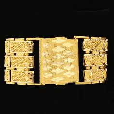 Price: $18,995 - CALL US TO ORDER 504-908-0011 Thick 3 weave style bracelet crafted of 21 karat gold. Specifications:Metal: 21K Yellow Gold Weight Total: 107gram Formal Yellow Gold Bracelet With Decorative Band, Luxury Chain Bracelet With Intricate Design, Luxury Yellow Gold Ceremonial Bracelets, Ceremonial Luxury Gold Jubilee Bracelet, Rectangular Gold Bracelet With 17 Jewels, 22k Yellow Gold Bracelet With Intricate Design, 22k Yellow Gold Filigree Bracelet, Intricate 22k Yellow Gold Bracelet, Luxury 22k Gold Bracelet For Formal Occasions