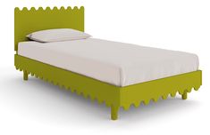 a green bed with white sheets and pillows on it's headboard is shown