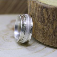 "Sterling silver statement ring for women. Spinner boho ring. Modern personalized wide band wedding ring. Every woman needs a gorgeous original jewelry piece that she'll treasure forever. This stunning spinner ring is one of my most popular items. It will keep your look chic & modern. The ring is super durable and is suited for everyday use. It can be engraved inside with words for your choice what makes is an ideal wedding ring. The ring will look amazing with both casual everyday wear and Handmade Adjustable Wide Band Ring For Wedding, Handmade Thick Band Wedding Jewelry, Handmade Thick Band Jewelry For Wedding, Unique Wide Band Ring For Wedding, Unique Wide Band Wedding Ring, Handmade Wide Band Wedding Ring, Bohemian Wide Band Rings For Anniversary, Adjustable Wide Band Engraved Ring For Wedding, Silver Wide Band Jewelry For Wedding