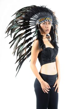 Black Indian headdress replica, chief warbonnet native american inspired, medium length boho headdress Rooster feathers natural black color with dark green shinny highlights Handmade with feathers, suede fabric, beads Hat circumference 59 cm approx, 23,2 inches approx Band: The geometric patterns of the decorative band made with beads on the front of the headdress may have some variations depending on what we have in stock at the time of the production of the headdress.Either way, the final deco Black Bohemian Costume Hats And Headpieces, Adjustable Black Headpieces For Festival, Bohemian Costume Hats And Headpieces With Feathers For Festivals, Black Bohemian Headpiece For Cosplay, Black Headdress, Black Ostrich Feather Headpiece, Black Feathered Headpiece For Costume, Indian Headress, Headdress Feather