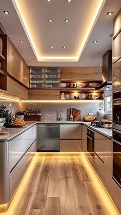 modern kitchen with wooden flooring and stainless steel appliances, along with recessed lighting