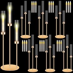 a group of candles that are next to each other on a black background with gold trimmings