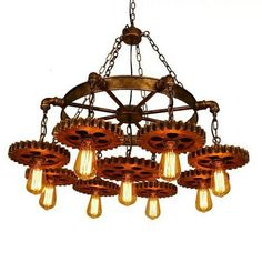 an old fashioned chandelier with many bulbs hanging from it's center beam