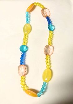 Tropical beaded necklace . Acrylic beads. 8 inch length Yellow Necklaces With Colorful Beads For Summer, Yellow Round Bead Necklaces For Summer, Yellow Round Beads Necklace For Summer, Summer Yellow Beaded Necklaces With Large Beads, Summer Yellow Beaded Necklaces, Yellow Single Strand Bohemian Necklace, Yellow Beaded Necklaces With Large Beads For Summer, Yellow Beaded Necklaces With Round Beads For Summer, Yellow Beaded Necklaces For Summer