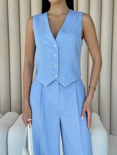 "Stylish blue pantsuit is the perfect choice for an elegant summer look!  Crafted from pure linen, the set features a cropped button-down vest and palazzo pants with convenient pockets.  The suit is perfect for hot days, casual wear for every day, office and college, business meetings and formal wear, also for special occasions, wedding guests, graduation, family celebrations and more.   DETAILS  - blue  - 100% linen  - 2 piece set  - crop vest  - buttoned  - high rise  - palazzo pants pockets Suit For Women Formal Wedding, Two Piece Blue Outfit, Light Blue Vest Outfits For Women, Blue Woman Suit, Formal Blue Outfit, Tailored Sets For Summer Workwear, Blue Suits For Women, Tailored Summer Sets For Workwear, Formal Summer Pantsuit With Notch Lapel