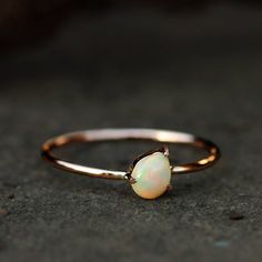 This ring made with genuine opal in solid 14k rose gold,Gemstone Pear Opal Ring Solid 14k Rose Gold Jewelry.Opal Ring, Engagement Ring, Wedding Bands, Gold Ring, Everyday JewelrySpecial customize for Anniversary, Birthday Gift, Valentine, Mother's Day Christmas. Item Details:Gross Weight :- 0.90 Grams14k Rose Gold Weight :- 0.86 GramsOpal Weight:- 0.18 CaratsRing Size:- 7 ( can be customized)Item SKU:- YTR-2163Please let us know if you required in other gemstones which is also possible. This is Pear Opal Ring, Opal Ring Engagement, Champagne Jewelry, Ear Wrap Earrings, 14k Rose Gold Jewelry, Friendship Day Gift, Ring Teardrop, Gold Opal Ring, Rose Gold Opal Ring