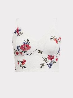 Soft and stretchy floral printed lace wraps a dreamy bralette that has flirty scalloped trim and is begging to peek out from tees and tanks. Matching style(s): Search 11665236. Wireless non-padded cups. Adjustable straps. Racerback. Scalloped lace trim. Semi-sheer . CONTENT + CARE: Nylon/spandex. Wash cold; dry flat. Imported plus size bra. SIZE + FIT: Model is wearing size 2 with Torrid Strapless Bra. The best plus size women's unlined lace crop bralette bras in patriot floral made of lace. V-neck Lace Crop Top With Lace Trim, Floral Print Lace Camisole Top, Lace Cami Crop Top With Lace Trim, Lace Tops With Spaghetti Straps And Floral Print, Lace Spaghetti Strap Top With Floral Print, Cropped Lace Tops With Built-in Bra, Lace Trim Lace Camisole Crop Top, Spring Lace Cami Bra, Spring Cami Bra With Lace Trim