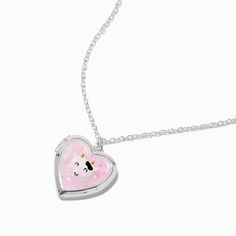 Write down your hopes, dreams, or whatever that mooves you and then tuck them inside this pretty heart-shaped locket to keep them close by. Or keep a picture of your bestie, your pet, or your family – whatever you hold dear. This silver-tone locket has a pink front that's decorated with a cow design. Finish: Silver-toneLength: 16 + 3 in. extender / 40.64 + 7.62 cm. extenderClosure: Lobster claspMaterial: Metal - Claire's Cow Heart Locket Pendant Necklace Cow Heart, Crown Hair Clip, Sensitive Ears Earrings, Piercing Kit, Cow Design, Tortoise Shell Cat, Word Bracelet, Locket Pendant Necklace, Jewelry Words