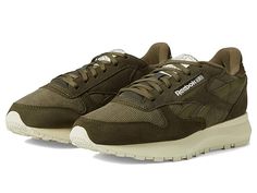 Reebok Lifestyle Classic Leather SP - Women's Shoes : Army Green/White : Take every step in style and comfort wearing Reebok Lifestyle Classic Leather SP Sneakers. Leather and textile upper. Textile lining and insole. Lace closure. Brand logo on side upper, tongue, and heel cap. Almond toe. Synthetic outsole. Imported. Measurements: Weight: 11 oz Product measurements were taken using size 8.5, width B - Medium. Please note that measurements may vary by size. Weight of footwear is based on a sing Shoes Reebok, Trendy Womens Shoes, Sneakers Athletic, Reebok Women, Heel Caps, Womens Reebok, Athleisure Wear, Comfort Wear, Classic Backpack