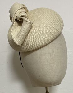 When you buy a Fascinator made from Toquilla Straw, you don't just buy a Fascinator, you buy a piece of art. This genuine Panama hat is woven in Ecuador by Ecuadorian Artisans. Colour & Dimensions: ---------------------- Classic Button shape Color Natural Diameter: 27 cm Design: Carole  Shape: Blocked using the Large wooden block high quality straw Elastic band inside  It is made from 100% toquilla straw, the same fiber used to make the very famous Panama Hat.   Be aware this hat is made from na Elegant Hat With Structured Crown In Natural Color, Elegant Natural Hat With Structured Crown, Woven Straw Hats With Structured Crown, Woven Straw Hat With Structured Crown, Natural Toquilla Straw Hat With Structured Crown, Structured Crown Natural Straw Hat, Natural Straw Hat With Structured Crown, Cream Adjustable Fascinator For Spring, Natural Structured Crown Straw Hat