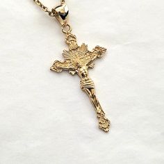 men's crucifix cross necklace pendant 3 L made in real 14k solid gold or real 18k solid gold all features that jesus and the ornaments are with exquisite detail. - this cross pendant 3 L height is 40mm without the bail. - the crucifix pendant necklace 3 M 34mm and L 40mm are on our store. - model wears a 2.1mm 50cm chain. - materials: real 14k solid gold, real 18k solid gold - free shipping via Fedex on all orders! - made in south korea 14k gold cross pendant necklace 3 L weight pendant only 4.7 14k Gold Crucifix Jewelry For Spiritual Expression, 14k Gold Crucifix Spiritual Jewelry, 14k Gold Spiritual Crucifix Jewelry, 14k Gold Crucifix Cross Necklace, 14k Gold Crucifix Necklace Spiritual Style, 14k Gold Crucifix Necklace For Spiritual Wear, Gold Cross Necklace Men, Cross Necklace Men, Mens Necklace Pendant