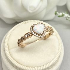 This beautiful ring is made from genuine 925 sterling silver with rose gold plating. Ring details- -The Main stone is a heart shape 6mm High Quality Lab Created White Fire Opal Stone -Side stones are round 1.5mm and 1.1mm simulated diamonds -Ring is casted in solid 925 sterling silver with rose gold plating (yellow gold and rhodium plated also available, please check the drop down menu for more options) -The Total face height of the ring measures 8mms and the band width measures 2mms -Each ring 14k White Gold Heart Promise Ring, White 14k Gold Heart Promise Ring, 14k Gold White Heart Promise Ring, Dainty Rose Gold Heart Cut Ring, 14k Gold Heart Cut White Ring, Rose Gold Heart Cut Promise Ring, Rose Gold Heart Cut Ring For Anniversary, White 14k Gold Heart Shaped Ring, White 14k Gold Heart Ring As Gift