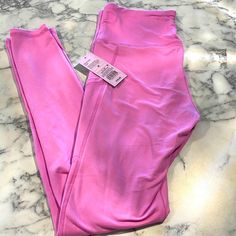 Brand Nwt Butter Soft Leggings With Pockets! Tag Says Purple But I Would Say More Of A Pink Color. Mid To High Rise Lavender Stretch Bottoms For Loungewear, Fitted Lavender Loungewear Bottoms, High Waist Stretch Lavender Bottoms, Purple Stretch Bottoms For Loungewear, Purple High Waist Stretch Leggings, Purple Full Length Leggings For Loungewear, Purple High Waist Workout Leggings, High Waist Purple Workout Leggings, Purple Tight Athleisure Pants