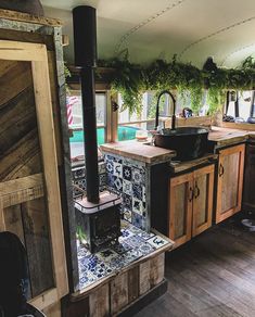 a kitchen with an oven and sink inside of it