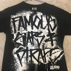 New Famous T-Shirt Sz Medium Black Hip Hop Top With Graffiti Print, Black Hip Hop T-shirt With Graffiti Print, Black Hip Hop Fan Merchandise Shirt, Black T-shirt With Graffiti Print For Fan Merchandise, Black Graffiti Print T-shirt For Fans, Black Hip Hop Shirt For Fan Merchandise, Black Hip Hop Shirt For Fans, Black Band Merch T-shirt With Graffiti Print, Black T-shirt With Graffiti Print Band Merch