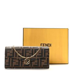 This is an authentic FENDI Vitello F is Fendi FF 1974 Embossed Continental Envelope Wallet On Chain in Maya and Black. This delightful wallet is crafted of FF embossed calfskin leather in brown and black and features an optional gold chain-link strap and a center Fendi logo in gold. The flap opens to a brown leather interior with card slots, patch pockets, and a zipper compartment. Fendi Crossbody Bag, Fendi Logo, Envelope Wallet, Fendi Wallet, Fendi Bags, Chain Bags