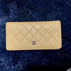 Beige Chanel Yen Long Flap Bifold Wallet Authentic Third Party Certificate Of Authenticity And Lifetime Warranty - Tag Attached To Wallet. I Never Used It. Other Than A Small Stain Inside The Flap, There Are No Signs Of Use Or Wear. Corners And Edges Are Perfect And Not Peeling At All. Caviar Leather Intact And Healthy. Silver Tone Hardware. Designer Gold Bifold Wallet, Classic Bifold Cream Wallet, Classic Cream Bifold Wallet, Elegant Tan Rectangular Wallet, Luxury Gold Bifold Wallet, Classic Cream Wallet For Formal Occasions, Elegant Tan Bifold Wallet, Luxury Beige Wallets With Card Slots, Classic Gold Bifold Wallet