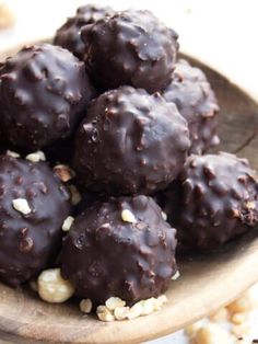 chocolate balls with nuts in a wooden bowl