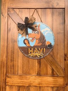 a wooden door with an image of a dog on it and the word hav