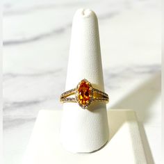 0.79ct Marquise Madeira Citrine With 0.29ctw Round Zircon 18k Yellow Gold Over Sterling Silver Ring. Measures Approximately 0.78"L X 0.52"W. Primary Stone Gemstone Color: Orange Gemstone Classification: Natural Gemstone Ctw: 0.79 Gemstone Dimensions: 10.00mm L X 5.00mm W Gemstone Enhancement: Heated Gemstone Full Name: Madeira Citrine Material Composition: Natural Origin Country: Brazil Gemstone Shape: Marquise Accent Stone(S) Gemstone Color: White Gemstone Classification: Natural Gemstone Ctw: Ss Ring, Cubic Zirconia Wedding Rings, Infinity Diamond Ring, Marquise Ring, Fancy Rings, Vintage Sterling Silver Rings, Vintage Diamond Rings, Charm Rings, Size 10 Rings