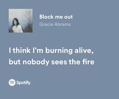 a woman with long hair standing in front of a blue background text reads, i think i'm burning alive, but nobody sees the fire