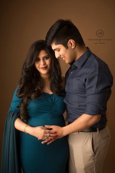 a pregnant couple standing next to each other