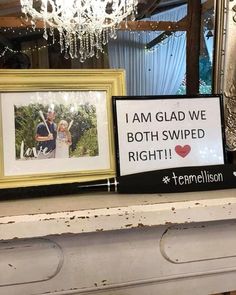 two framed pictures are sitting on top of a mantel with a sign saying i am glad we both swipe right