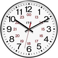 a white clock with black hands and numbers on the face is showing eleven o'clock