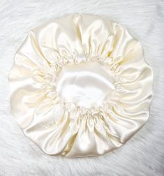 Our beautiful silky-smooth reversible satin hair Bonnet is handmade with  Premium quality satin fabric. Great way to protect your hairstyle day time and night. Very comfortable to wear made with 100% polyester Ideal for night sleep and to protect hairstyle. PLEASE NOTE: WE ARE SO CONFIDENT IN OUR PRODUCT, 30 DAYS MONEY BACK GUARANTEE  Small size: 20-21 inches (elastic) Medium size: 22-23 inches (elastic)  Larger size: 24-25 inches (elastic) If you require different sizes than what we have listed above. Send us a message with your order and the size you want.  Hand wash is highly recommended Air dry only  Do not bleach  Can iron on a low heat Satin Hair Bonnet, Sleep Hat, Satin Bonnet, Hair Bonnet, Shower Caps, Day Time, Your Hairstyle, Night Sleep, Head Scarf