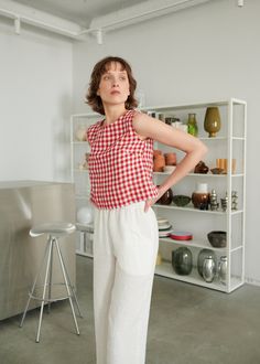 "The Crop top is a summer essential that goes well with other pieces in different shapes. Because of its heavy-looking wide hem and bust darts, the top helps you create an outstanding yet simple look that you can easily adjust for the occasion by playing around with additional layers or accessories. SIZING & FIT This garment is true to size, and we recommend choosing the size you usually wear. If you want the garment to be loose-fitting, choose a larger size than you usually wear. Before pla Sleeveless Gingham Blouse For Summer, Summer Sleeveless Gingham Blouse, Plaid Linen Tops For Spring, Spring Plaid Linen Top, Red Linen Top For Spring, Red Gingham Top, Gingham Linen, Gingham Top, Linen Tank Top