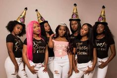 a group of young women wearing party hats