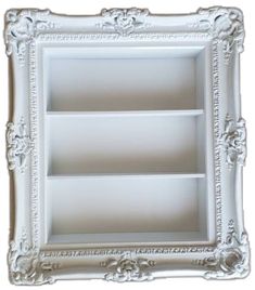 an ornate white frame with three shelves in the middle and one shelf below, on a white background