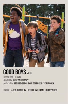 two boys standing next to each other in front of a playground with the words good boys on it