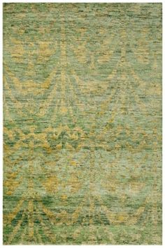 an area rug with green and yellow colors