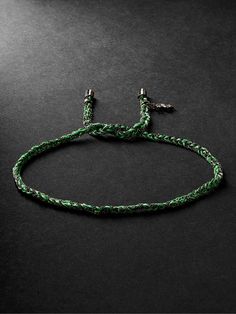 Carolina Bucci says she likes to constantly play with her jewellery, which explains why her designs, including this 'Lucky' bracelet, are tactile. Inspired by braided cotton friendship styles, it's hand-woven from 'Apple Green' silk, tipped with blackened gold and has a dollar-sign charm. Luxury Adjustable Braided Jewelry, Green Woven Bracelet Jewelry, Luxury Braided Adjustable Bracelets, Luxury Green Adjustable Bracelet, Luxury Adjustable Braided Jubilee Bracelets, Luxury Adjustable Braided Jubilee Bracelet, Green Braided Bracelet Jewelry, Green Braided Bracelets As Gift, Adjustable Green Woven Jewelry