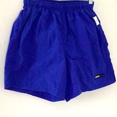 Blue Swim Trunks Have In Elastic Waist With Mesh Lining And A New With Tags. Casual Purple Nylon Activewear, Purple Casual Summer Activewear, Blue Nylon Casual Activewear, Functional Blue Activewear For Beach, Basic Blue Activewear For Gym, Basic Blue Activewear For Workout, Navy Casual Activewear For Summer, Basic Blue Sports Activewear, Basic Blue Activewear For Sports